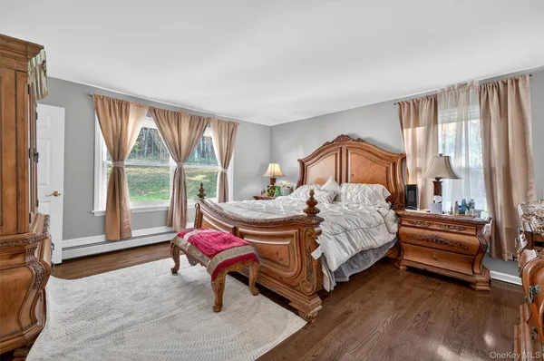 a bedroom with a bed chair and window