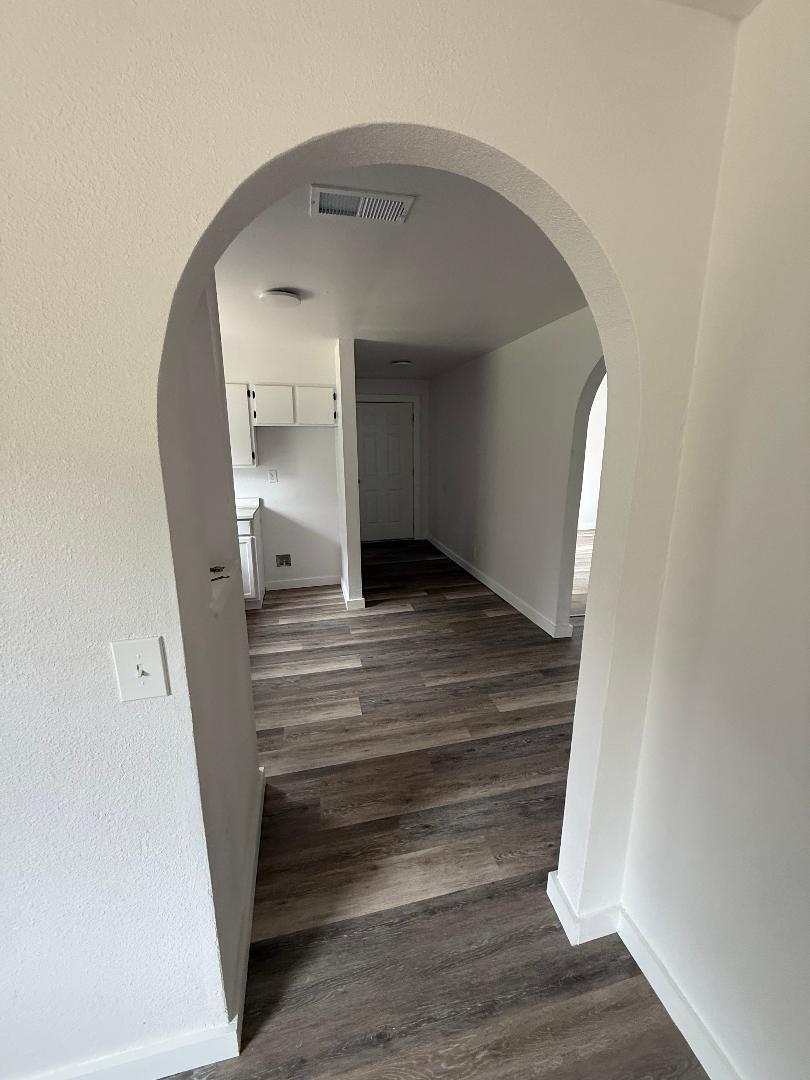 200 North Pleasant Street Geneva, AL 36340 - Photo 10 of 19 a view of entryway and hall with wooden floor