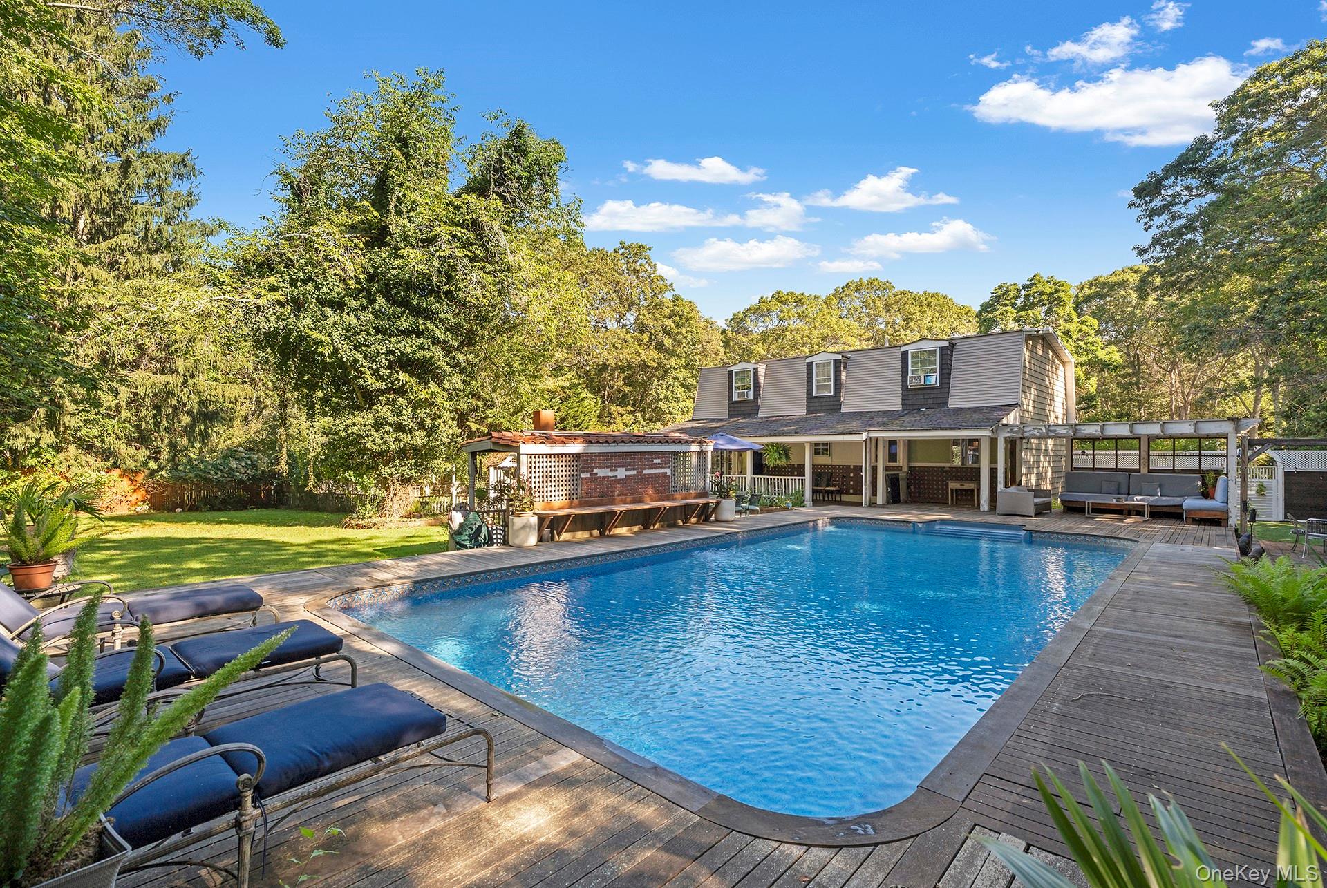 a view of a swimming pool with lounge chair