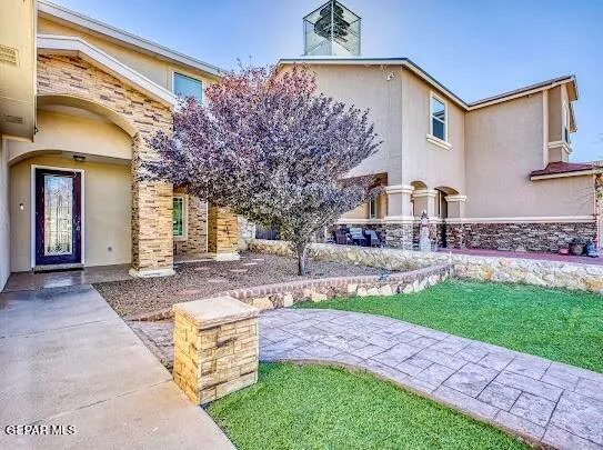 a kitchen with stainless steel appliances granite countertop a refrigerator stove and a sink