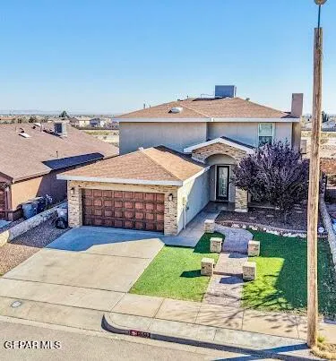 an aerial view of a house with swimming pool and furniture