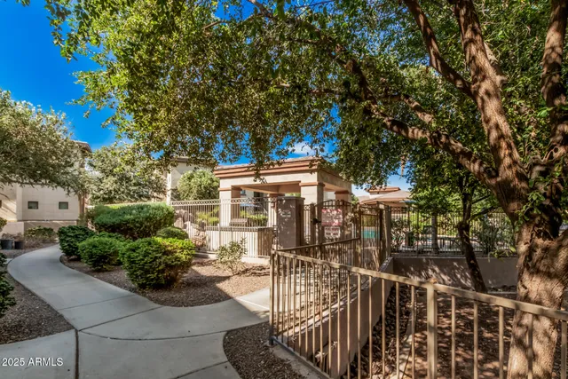 a view of a patio with couches table and chairs and potted plants