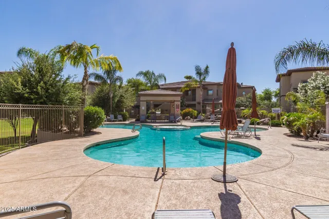 a swimming pool with outdoor seating yard and barbeque oven