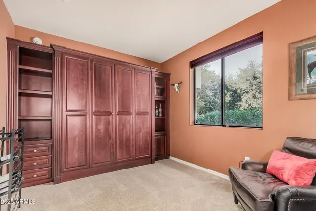 a livingroom with furniture and a window