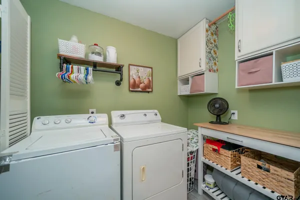 a view of storage and utility room with washer and dryer