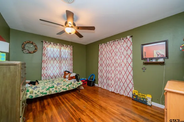 a bedroom with furniture and a window