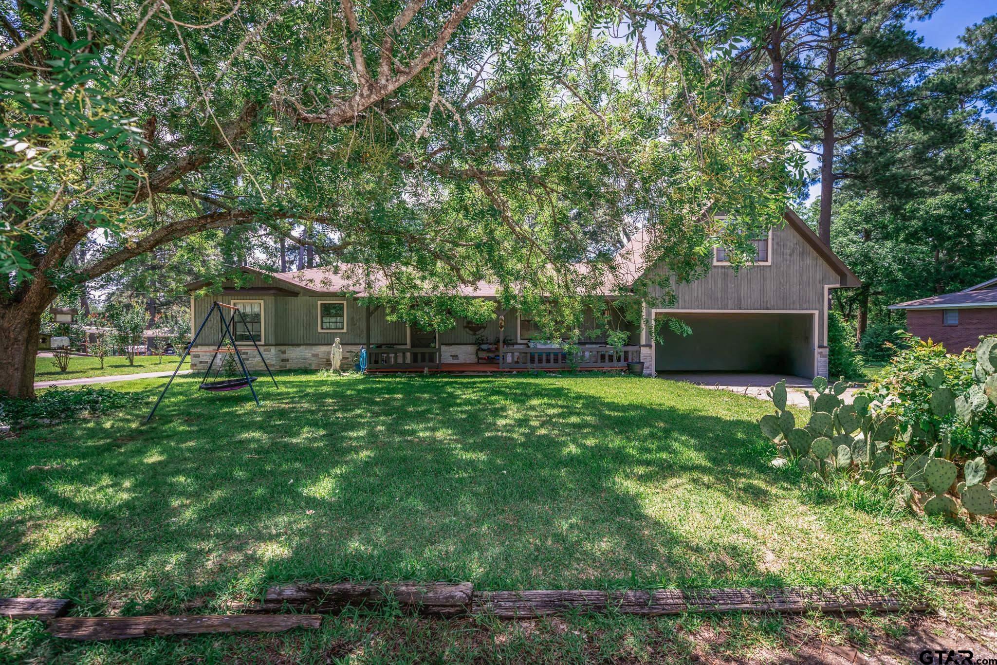 141 Cedar Street Rusk, TX 75785 - Photo 41 of 44 a front view of a house with garden