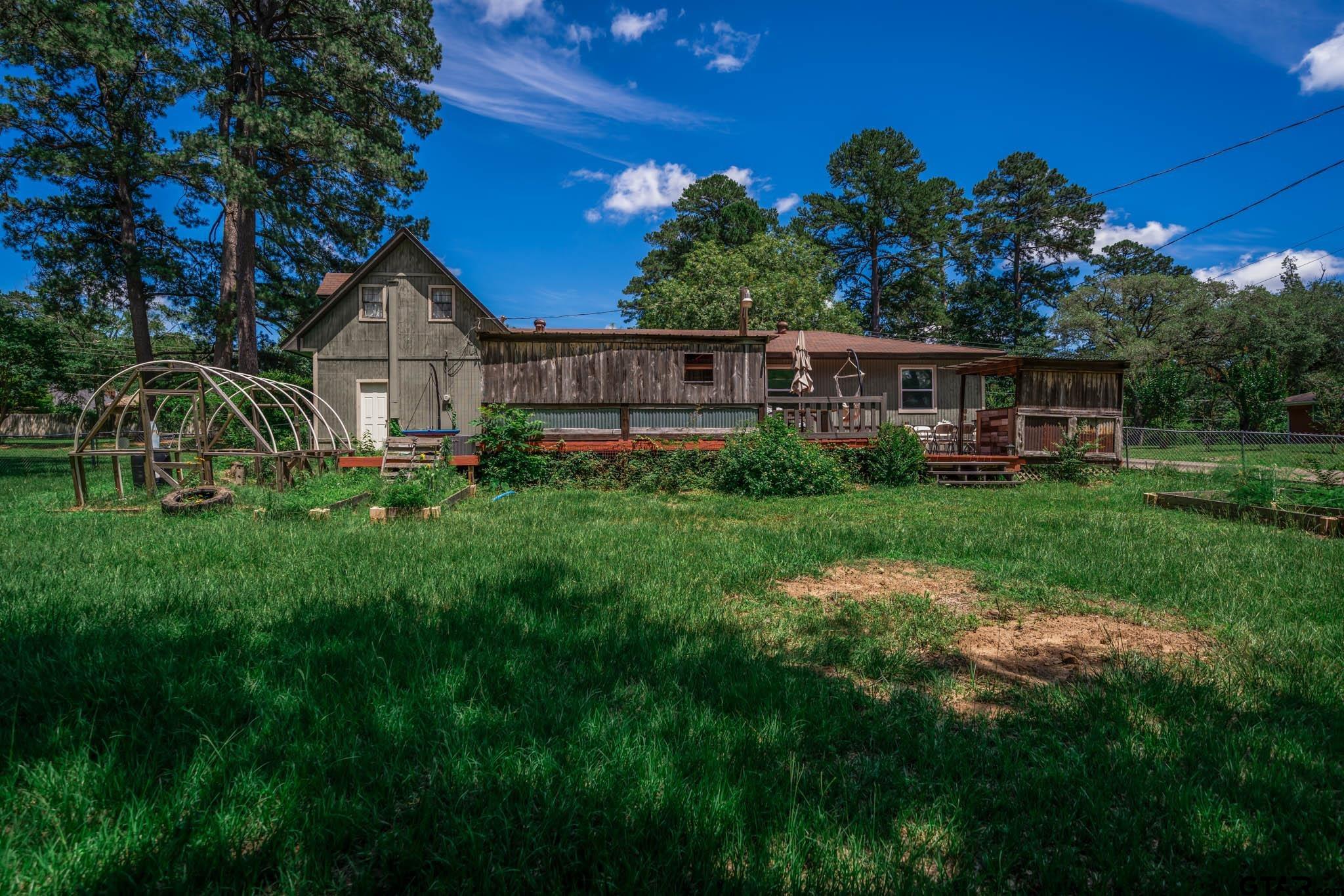 141 Cedar Street Rusk, TX 75785 - Photo 5 of 44 a front view of a house with garden