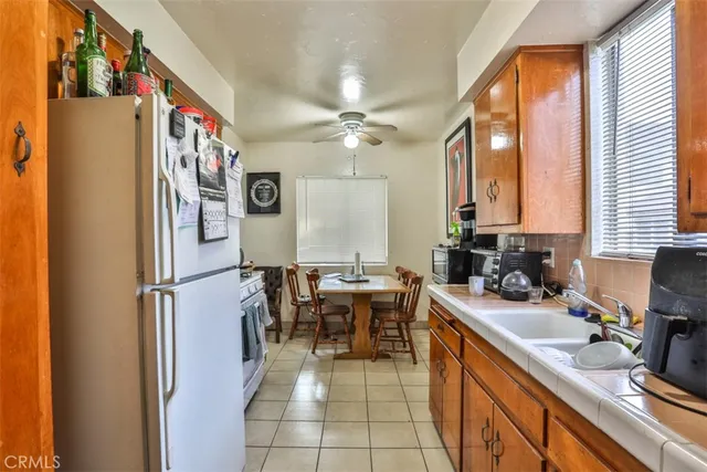 a kitchen with a sink appliances and furniture
