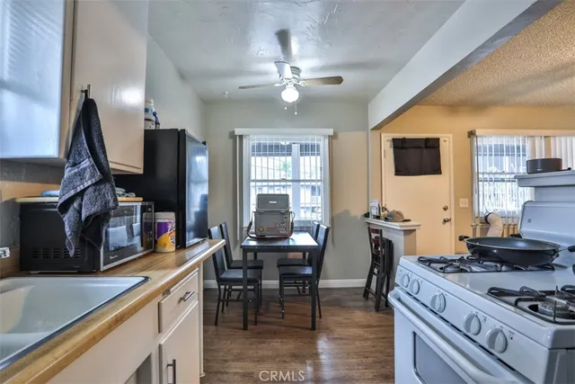 a kitchen with stainless steel appliances granite countertop a stove and a sink