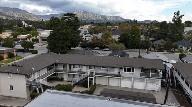 an aerial view of a house with roof deck
