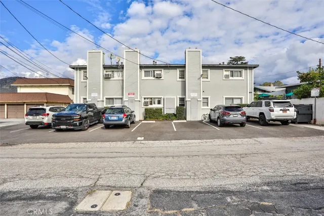 a view of road with card parked car