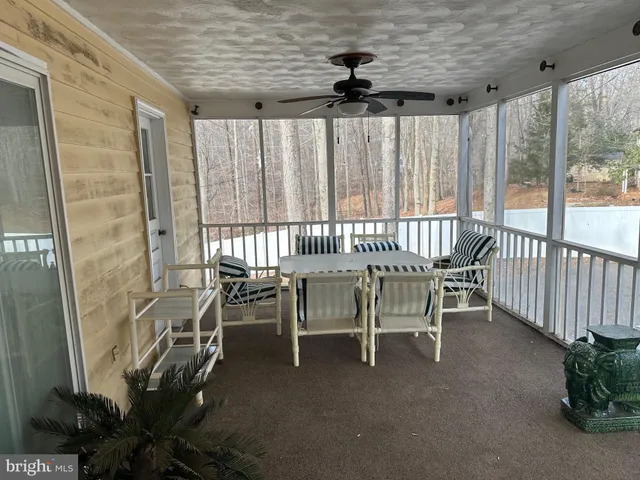 a dining room with furniture and windows