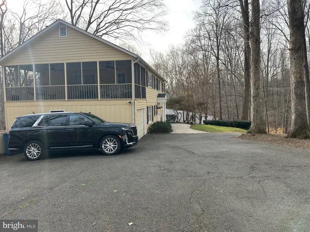 a car parked in front of a house