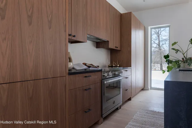 a kitchen with stainless steel appliances a refrigerator and a stove