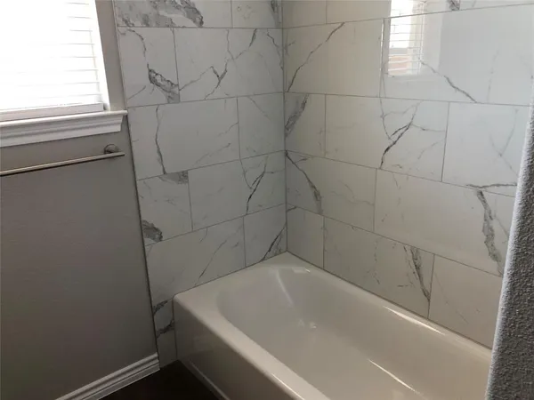 a bathroom with a bathtub