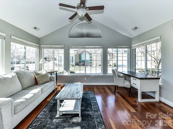 a living room with furniture and a large window