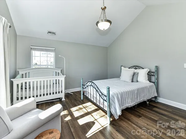 a bedroom with bed and window