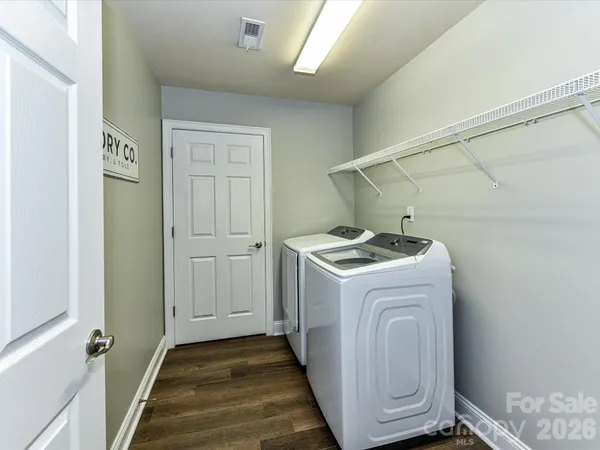 a utility room with dryer and washer