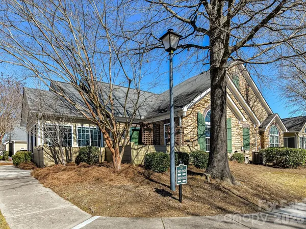a view of a house with a tree