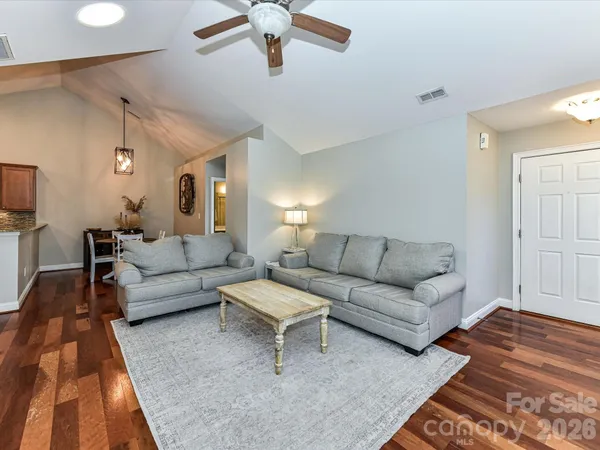 a living room with furniture and a rug