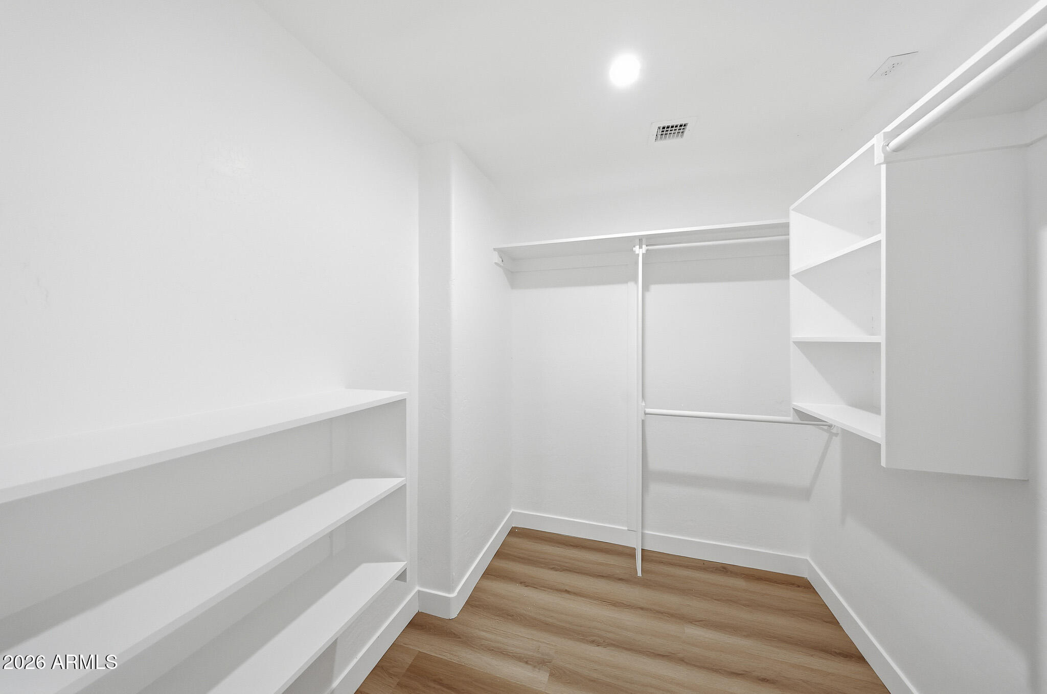 916 East Harwell Road Phoenix, AZ 85042 - Photo 13 of 27 a view of an empty walk in closet