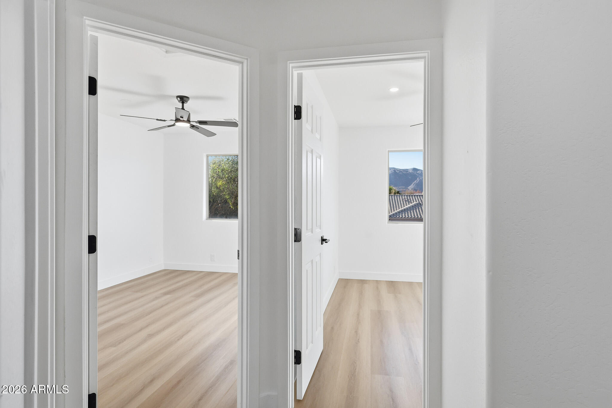 916 East Harwell Road Phoenix, AZ 85042 - Photo 19 of 27 a view of a hallway with wooden floor and closet area