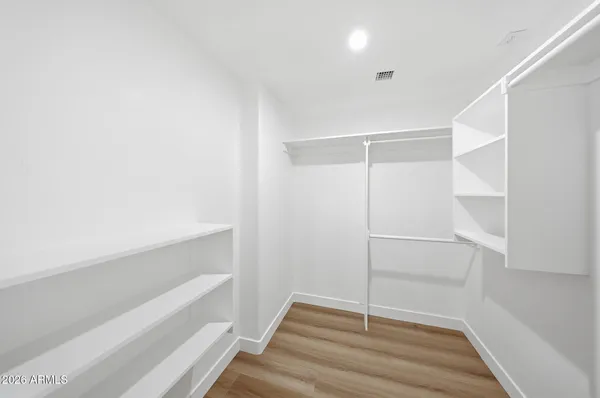a view of an empty walk in closet