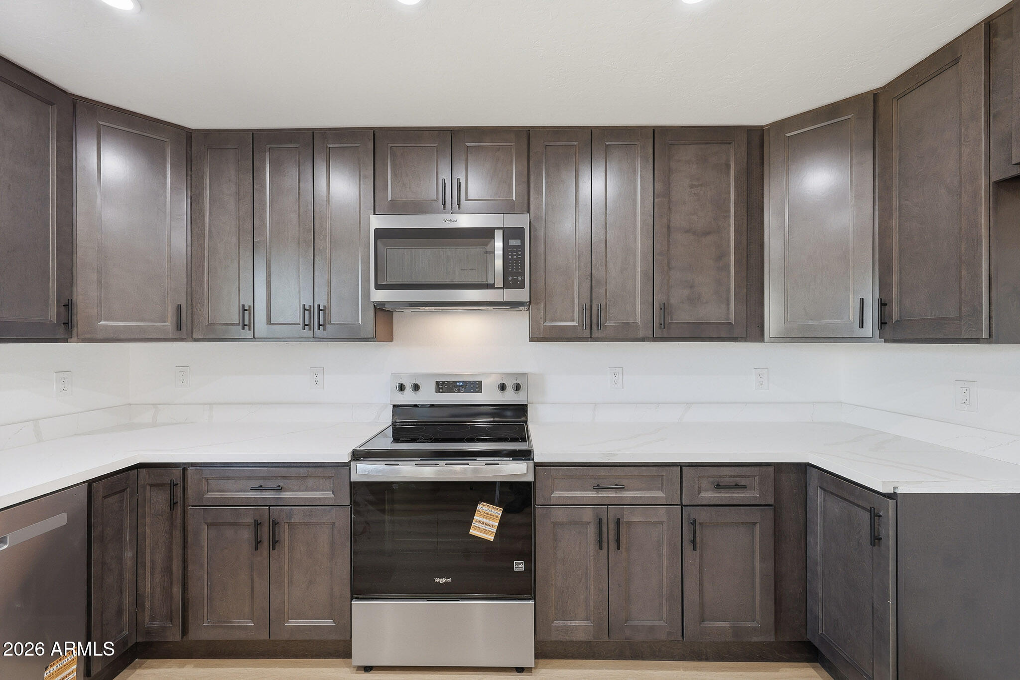 916 East Harwell Road Phoenix, AZ 85042 - Photo 6 of 27 a kitchen with sink cabinets and stainless steel appliances