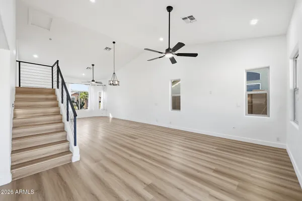 a view of an entryway with wooden floor