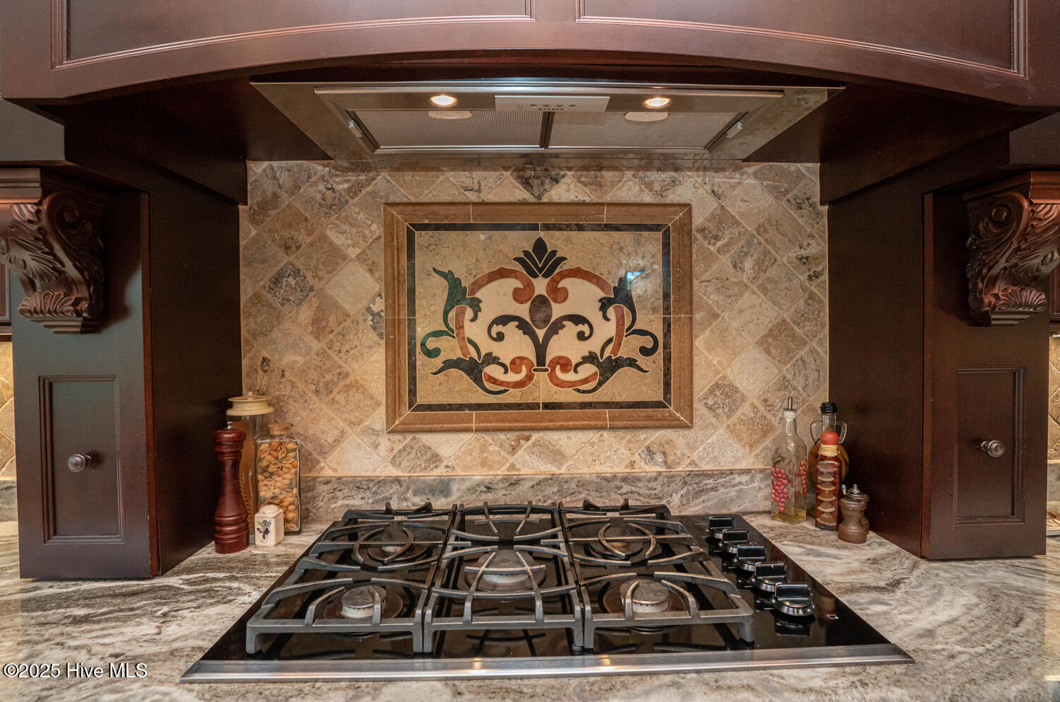 6756 Limerick Place Southwest Ocean Isle Beach, NC 28469 - Photo 25 of 120 Gas Cooktop with unique inlay tile backsplash