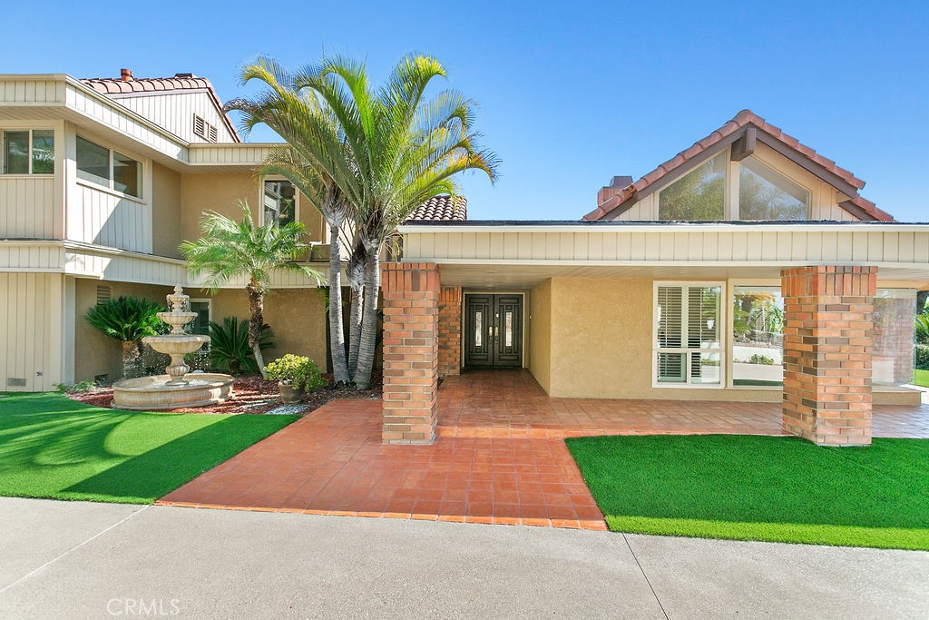 18811 Ridgeview Circle Villa Park, CA 92861 - Photo 5 of 34 a front view of a house with a yard and garage