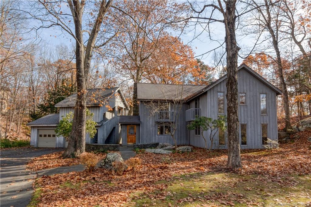 1231 Moose Hill Road Guilford, CT 06437 - Photo 1 of 1 a front view of a house with garden