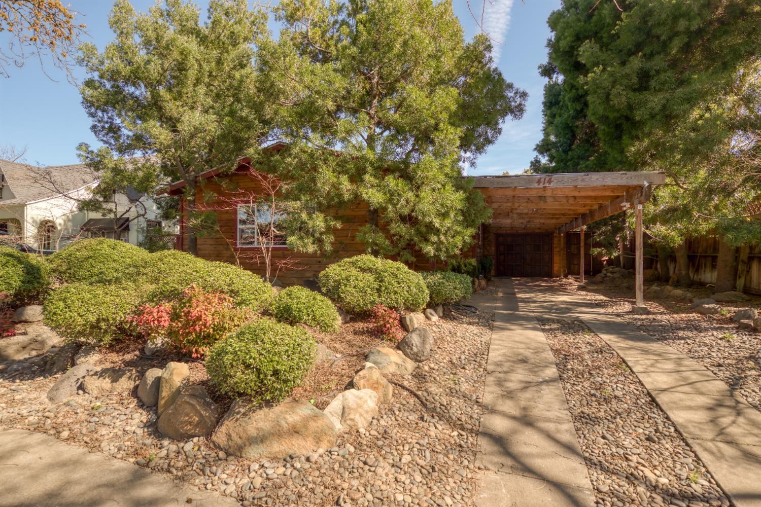 414 Melrose Street Modesto, CA 95354 - Photo 1 of 1 a front view of a house with a yard