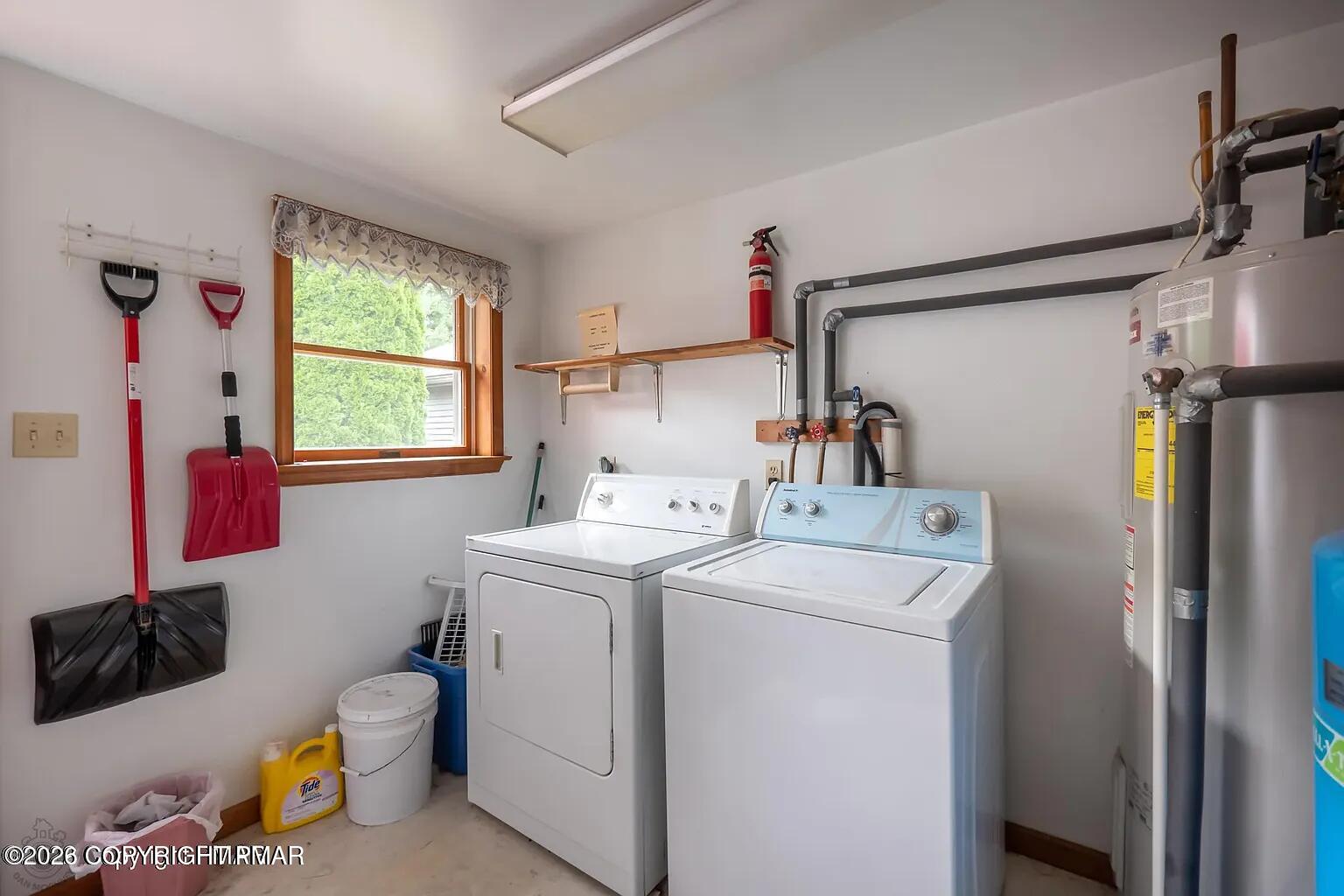 165 Old Stagecoach Road, Unit 3 Gilbert, PA 18331 - Photo 11 of 20 a view of storage and utility room with a washer and dryer