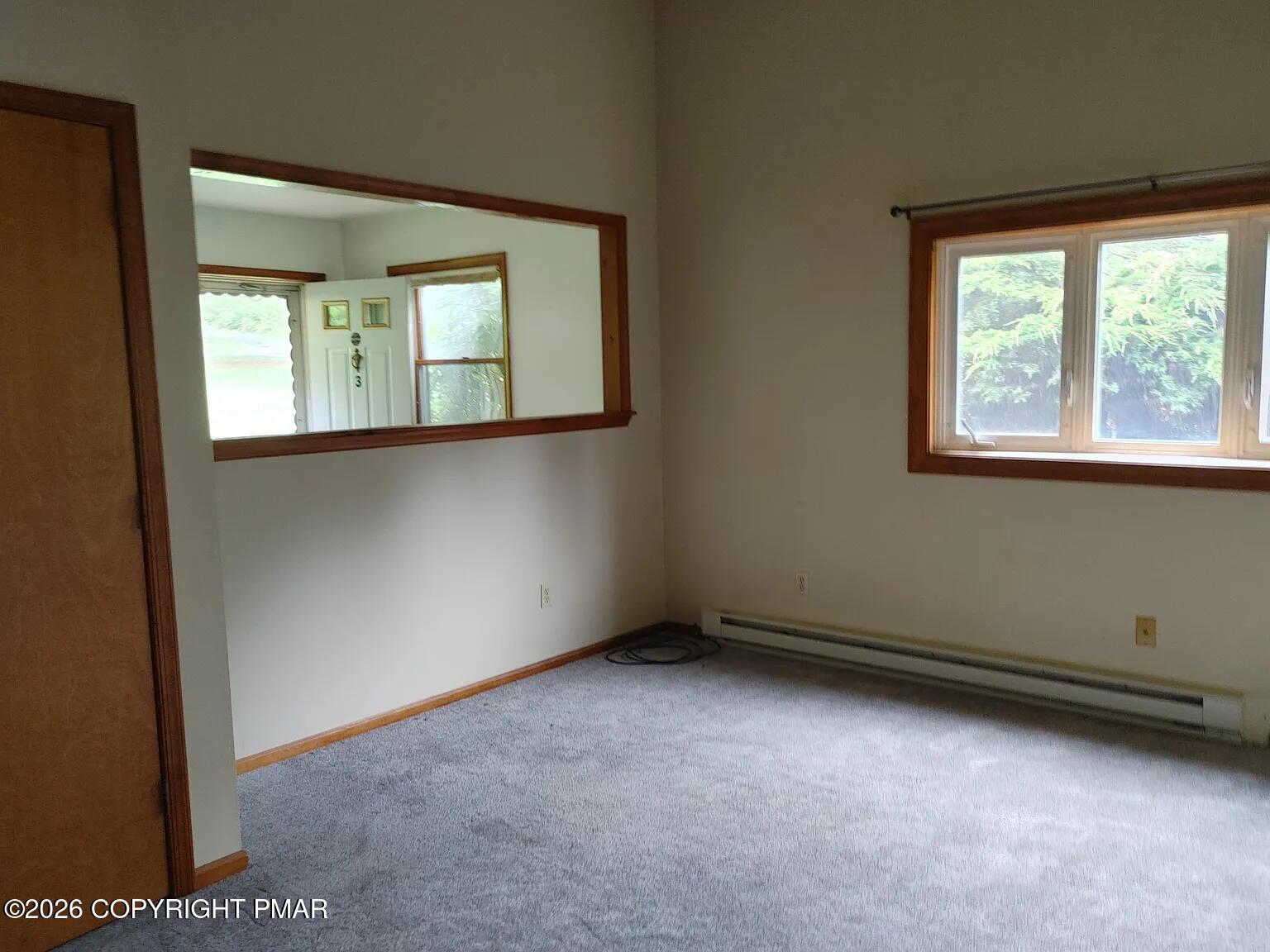 165 Old Stagecoach Road, Unit 3 Gilbert, PA 18331 - Photo 17 of 20 an empty room with a window