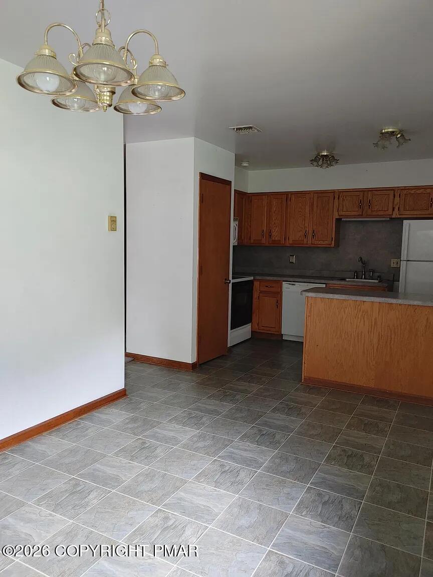 165 Old Stagecoach Road, Unit 3 Gilbert, PA 18331 - Photo 18 of 20 a view of kitchen with cabinets