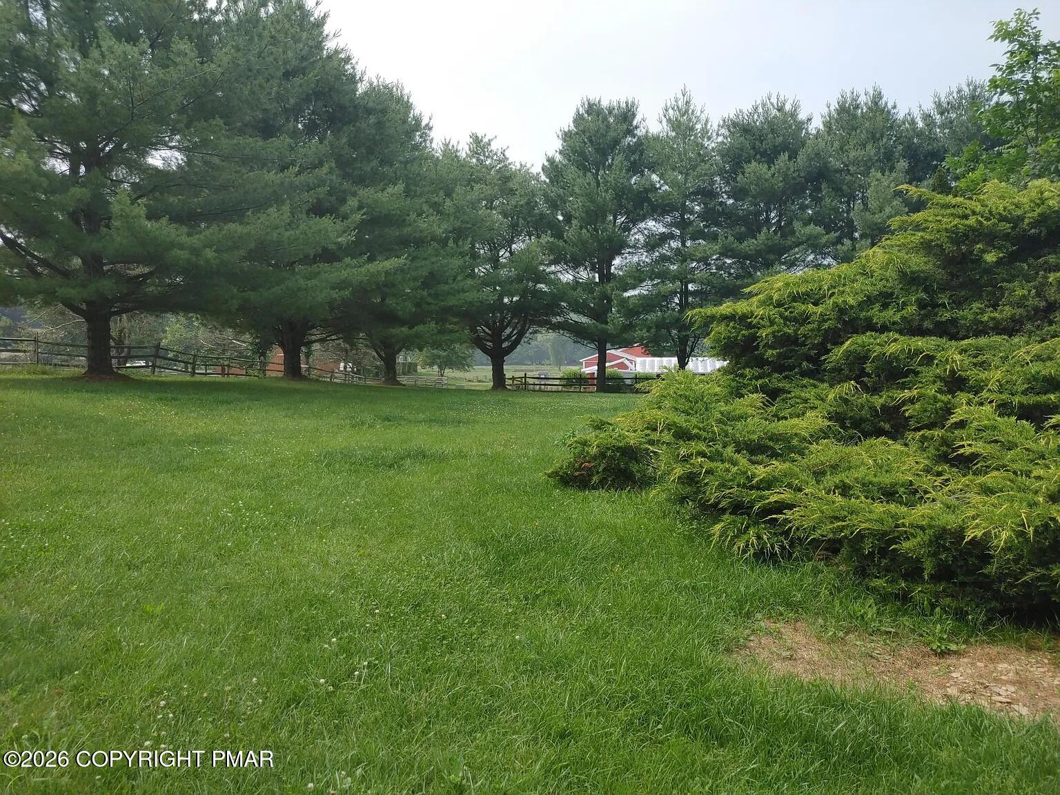 165 Old Stagecoach Road, Unit 3 Gilbert, PA 18331 - Photo 3 of 20 a view of a field of grass and trees