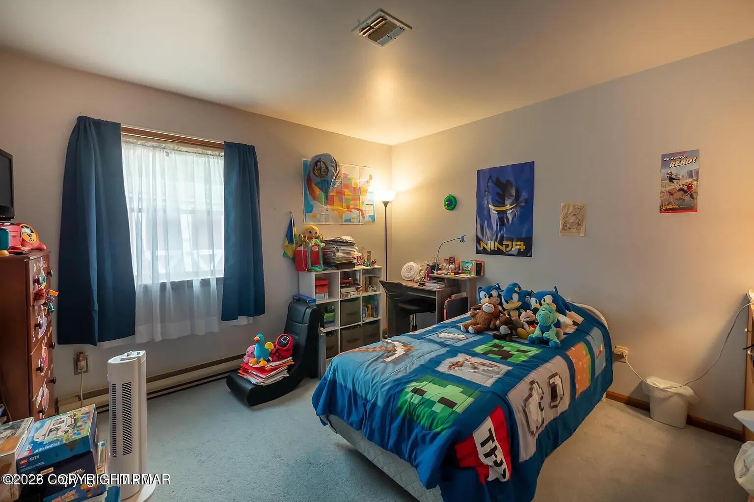 165 Old Stagecoach Road, Unit 3 Gilbert, PA 18331 - Photo 9 of 20 a bedroom with bed and a window