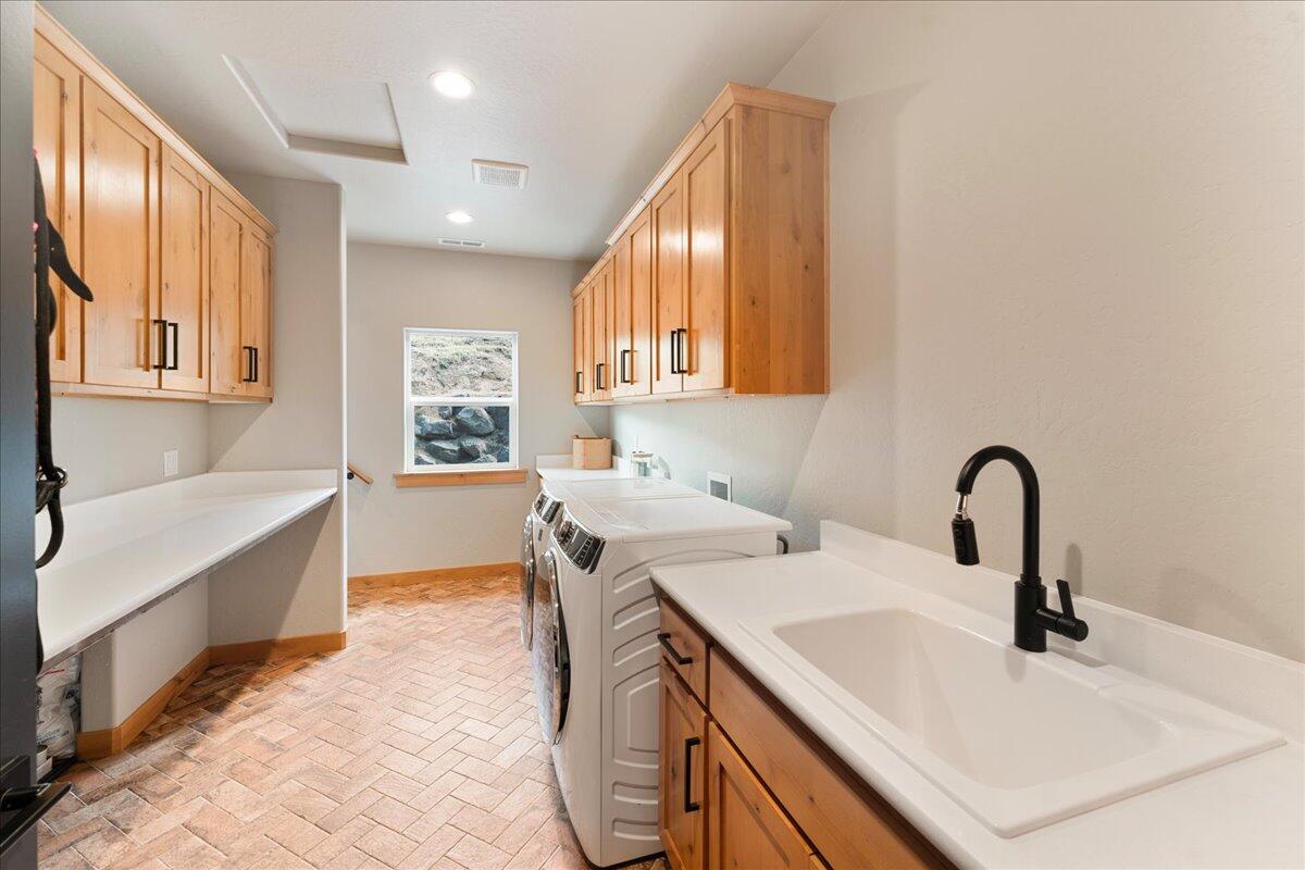 2220 Butte Falls Highway Eagle Point, OR 97524 - Photo 44 of 69 a kitchen with a sink a counter top space and cabinets