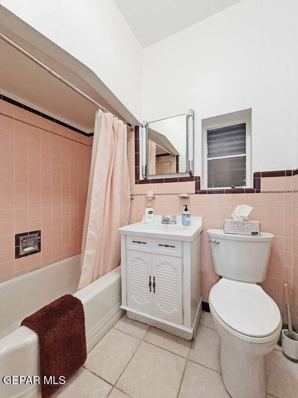 4135 Emory Road El Paso, TX 79922 - Photo 58 of 73 a bathroom with a toilet sink and mirror