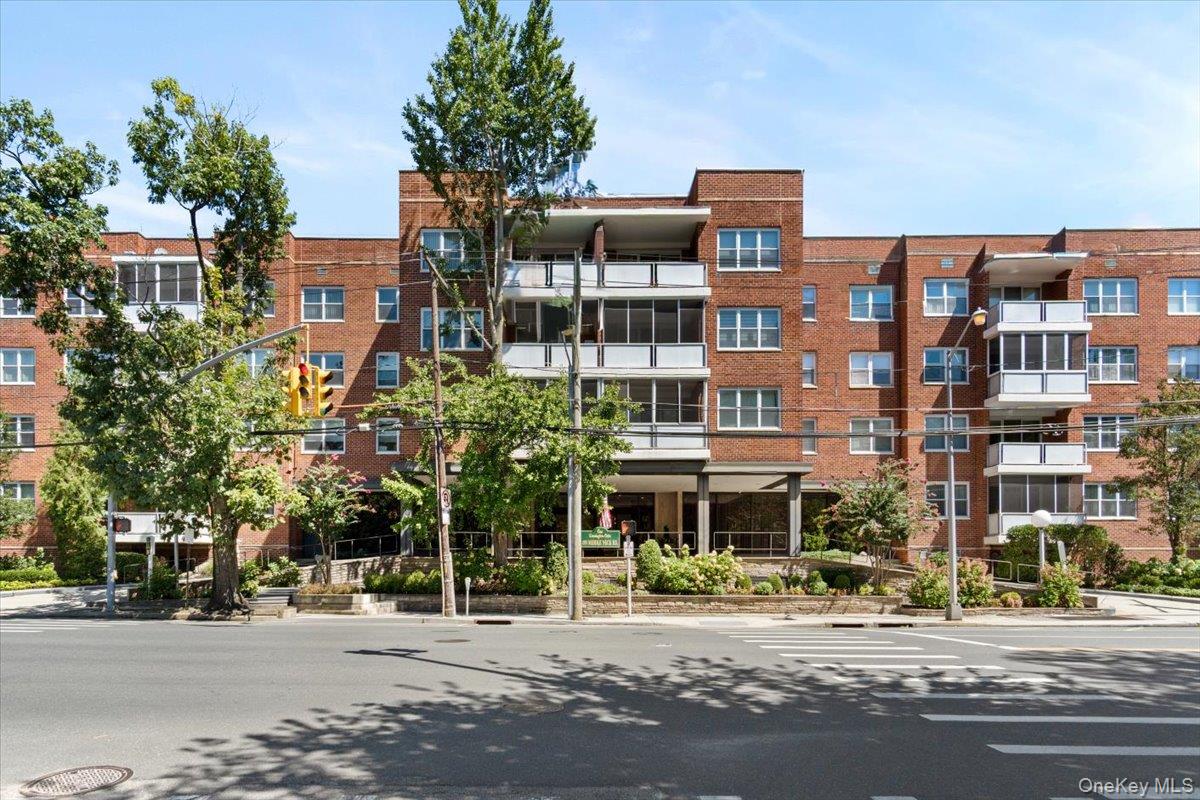 1 Kensington Gate, Unit 112 Great Neck, NY 11021 - Photo 1 of 1 a front view of a building with street view