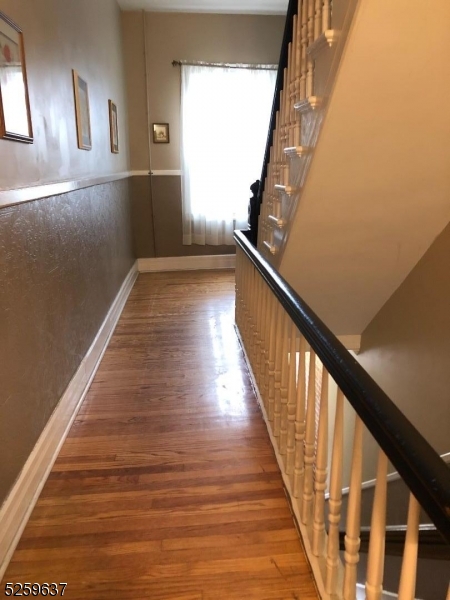 9 Moran Street, Unit 3 Newton, NJ 07860 - Photo 13 of 13 a view of a hallway with wooden floor and staircase