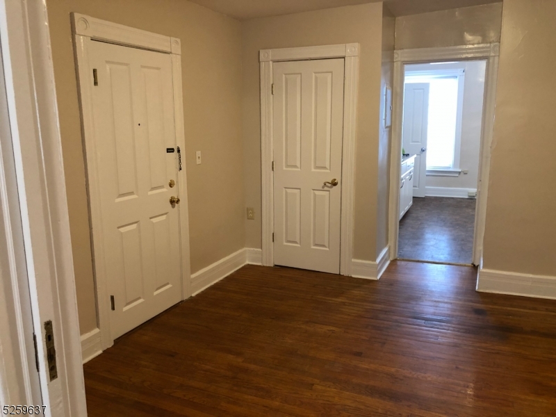 9 Moran Street, Unit 3 Newton, NJ 07860 - Photo 2 of 13 a view of a hallway with wooden floor