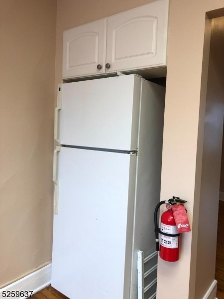 9 Moran Street, Unit 3 Newton, NJ 07860 - Photo 10 of 13 a kitchen with a refrigerator and cabinets