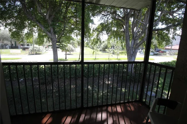 a bathroom with a granite countertop sink toilet a shower and a mirror