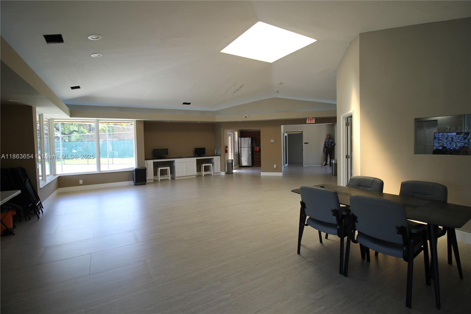 721 Northwest 103rd Terrace, Unit 202 Pembroke Pines, FL 33026 - Photo 24 of 24 a dining room with furniture and wooden floor