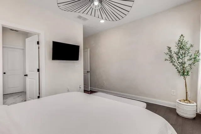 a bathroom with double sink and a mirror