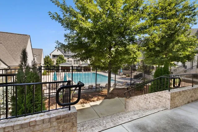 an aerial view of a house with garden space and houses