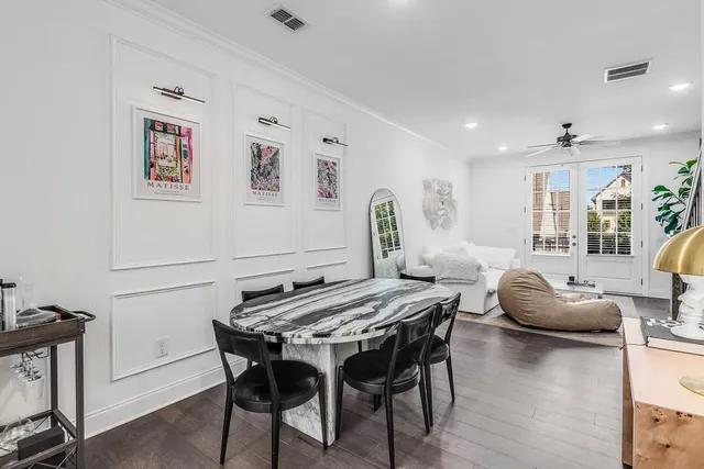 a kitchen with refrigerator cabinets and wooden floor